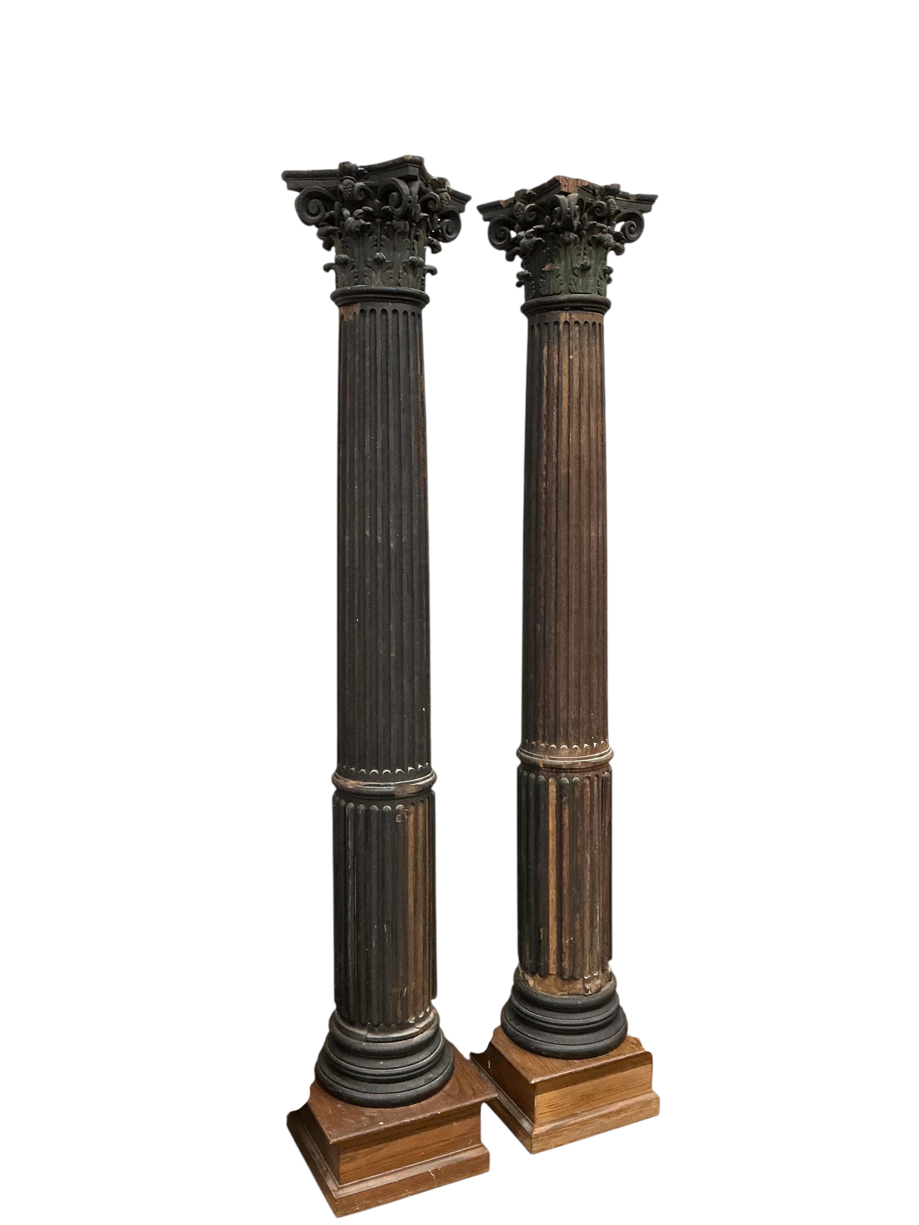 A pair of 17th century oak Corinthian columns, of large size, height 279cm, from St Mary le Bow, designed by Christopher Wren